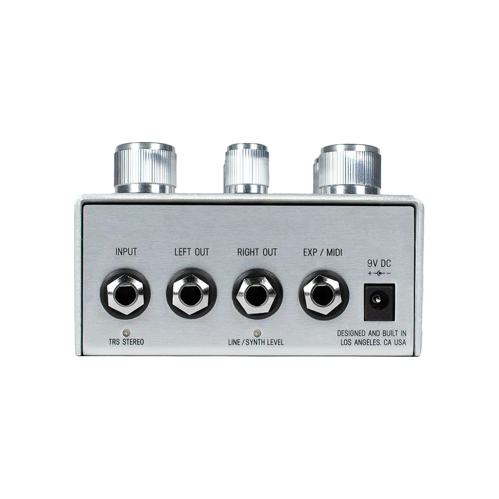 A back view of the silver Meris Hedra guitar pedal, on the back of the pedal are various input and output ports as well as a 9V DC power port