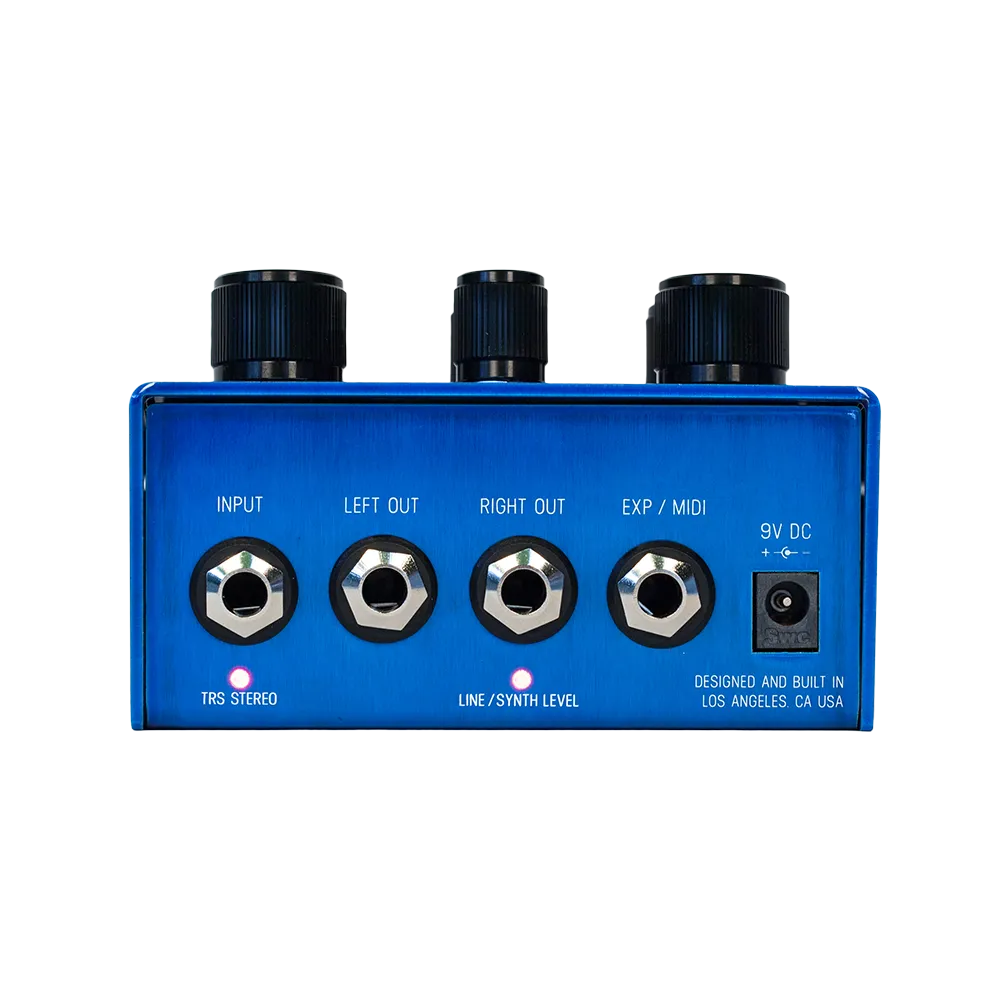 A back view of the blue Meris Mercury 7 Reverb guitar pedal, the image shows the input and output ports for the pedal as well as a 9V DC power input