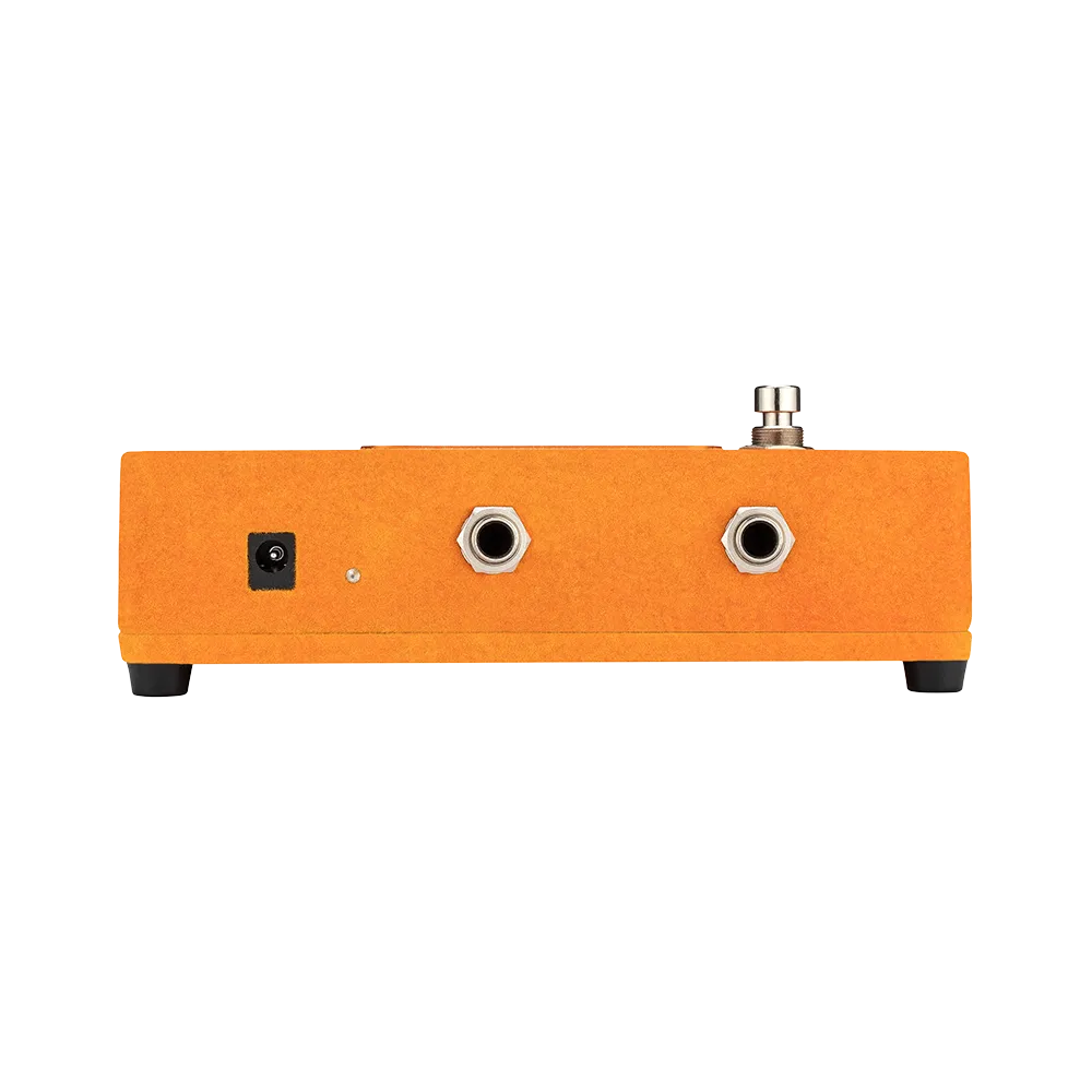 A back view of the Warm Audio Foxy guitar pedal, on the back of the pedal are input and output ports as well as a power port