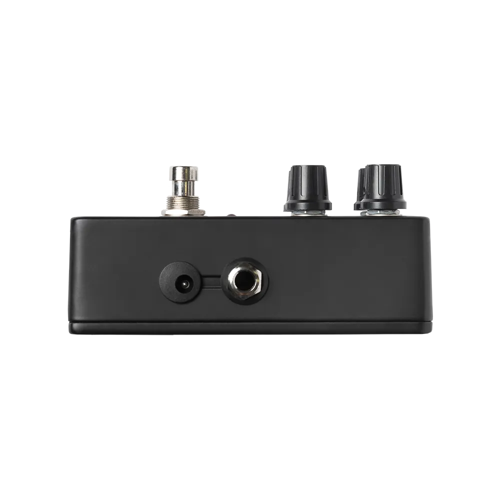 A side view of the Warm Audio Warmdrive guitar pedal, on the side of the pedal is an output port as well as a power port