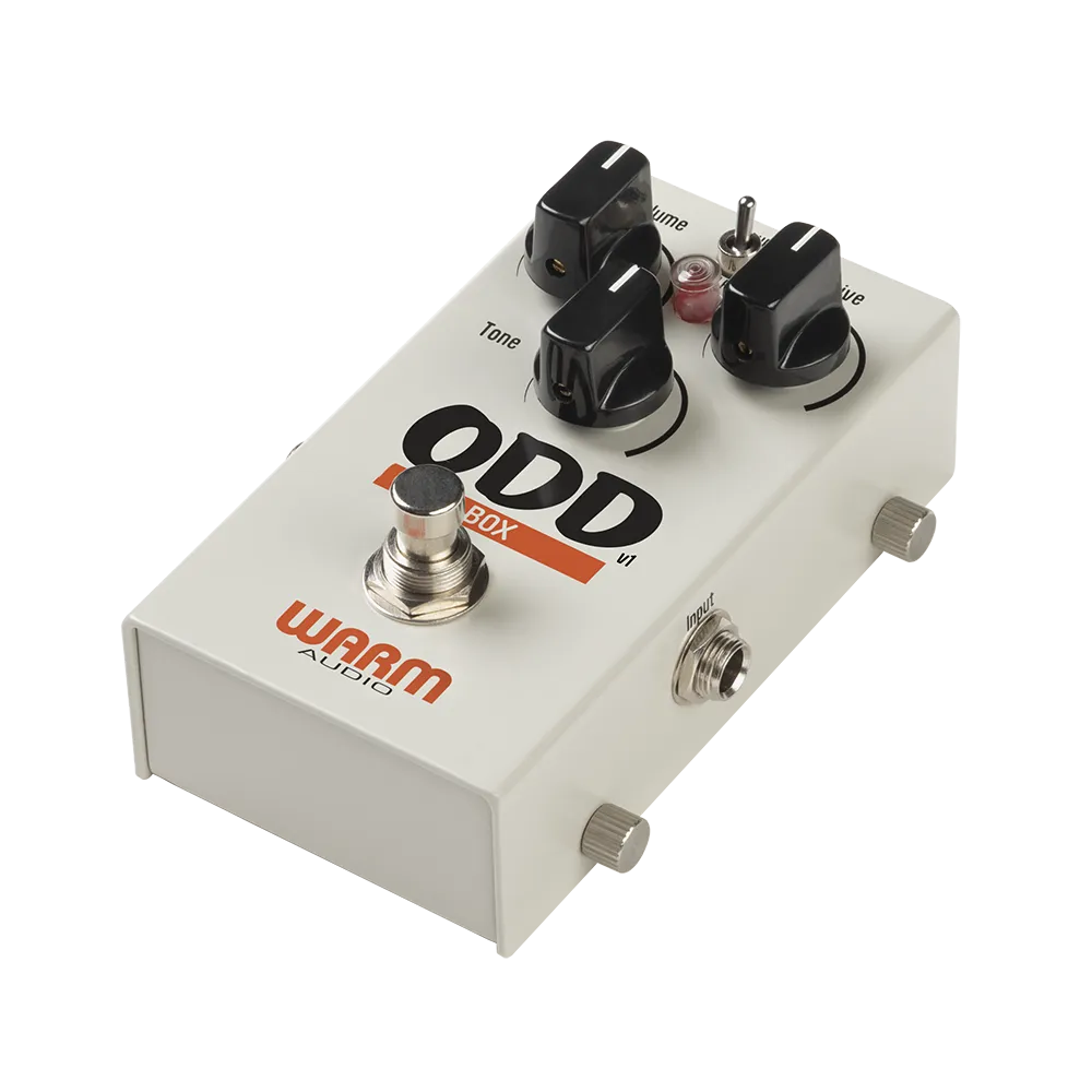A top/side view of the Warm Audio Odd box guitar pedal, on the top of the pedal are 3 dials to control the output